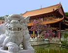 Statue of Maitreya lighted by butter lamps, Drepung Monastery